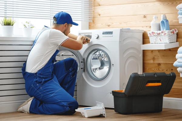 working-man-plumber-repairs-washing-600nw-1051194281